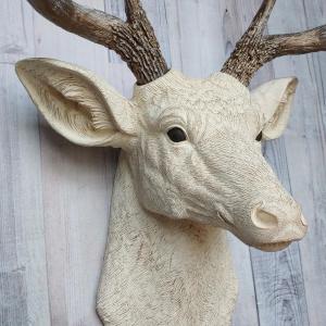 Faux taxidermy deer head wall mount. Head is painted antique white with antique gold accents, antlers are antique gold with antique white accents.