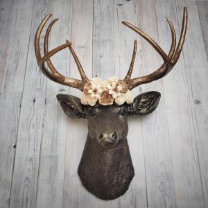 Dark brown and gold faux taxidermy deer head with sola floral crown