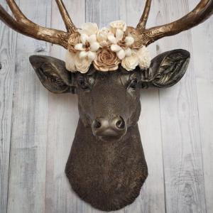 Dark brown and gold faux taxidermy deer head with sola floral crown