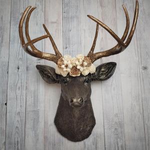 Dark brown and gold faux taxidermy deer head with sola floral crown