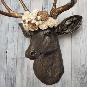 Dark brown and gold faux taxidermy deer head with sola floral crown