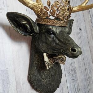 Faux taxidermy deer head with gold metal leaf crown and bow tie.