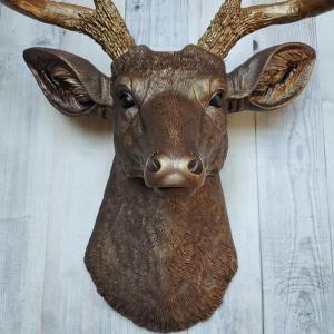 Faux taxidermy deer head painted dark copper with antique gold accents and antique gold antlers.