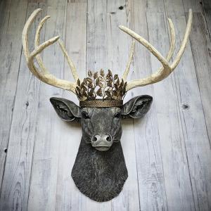 faux taxidermy deer head wall mount. Painted in a chestnut brown, antique white and gold finish with a antiqued gold metal leaf crown on the top of its head.