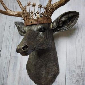 Faux taxidermy stag head, faux taxidermy deer head that's been painted rubbed bronze with antique gold accents. The antlers have been painted antique gold and a vintage inspired Santos crown adorns the deers head.