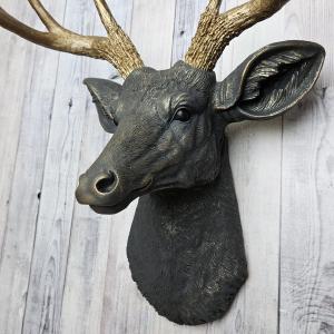 Faux taxidermy deer head, painted slate grey with antique gold accents. 