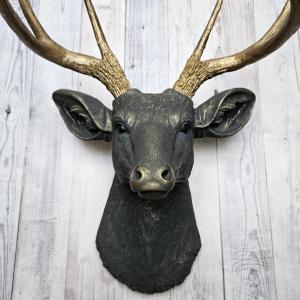 Faux taxidermy deer head, painted slate grey with antique gold accents. 