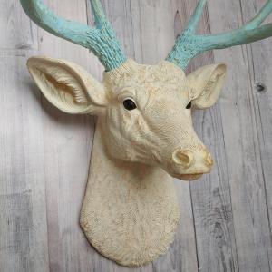 Faux taxidermy deer head, painted antique white with spa blue and gold accents. The antlers are spa blue with gold accents.