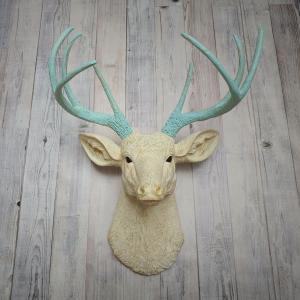 Faux taxidermy deer head, painted antique white with spa blue and gold accents. The antlers are spa blue with gold accents.