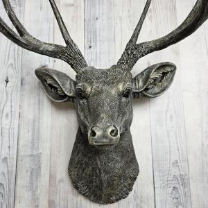 Faux taxidermy deer head, painted chestnut brown with antique white and gold accents. The antlers have been painted the same way.