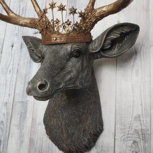 Faux taxidermy deer head, painted chestnut brown with antique white and gold accenting. The antlers are antique gold and a vintage inspired Santos crown sits stop the deers head.