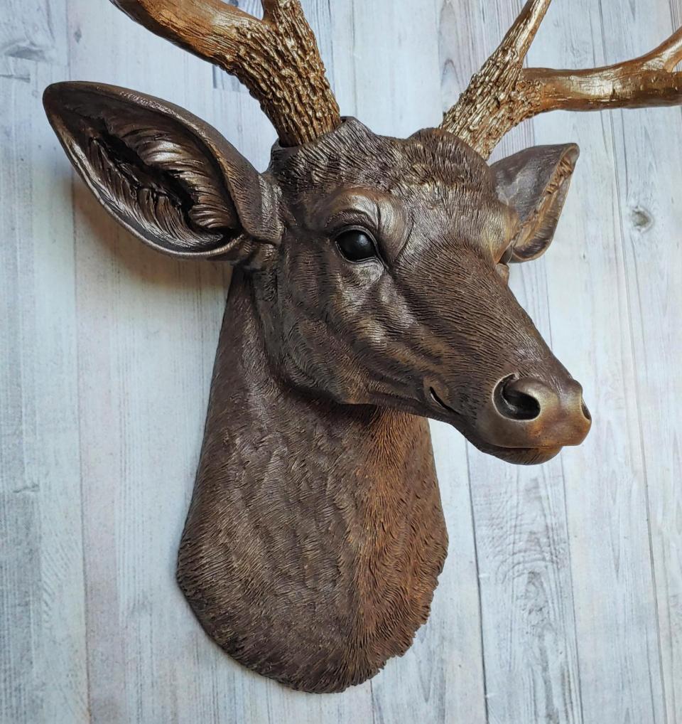 Faux taxidermy deer head painted dark copper with antique gold accents and antique gold antlers.