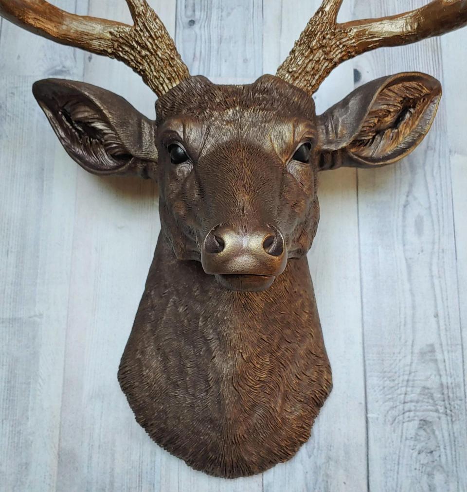 Faux taxidermy deer head painted dark copper with antique gold accents and antique gold antlers.