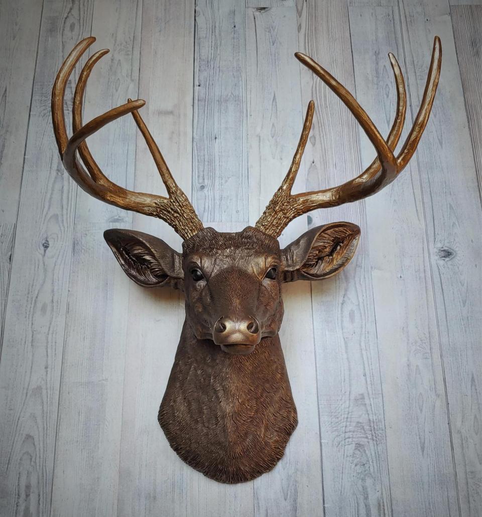 Faux taxidermy deer head painted dark copper with antique gold accents and antique gold antlers.
