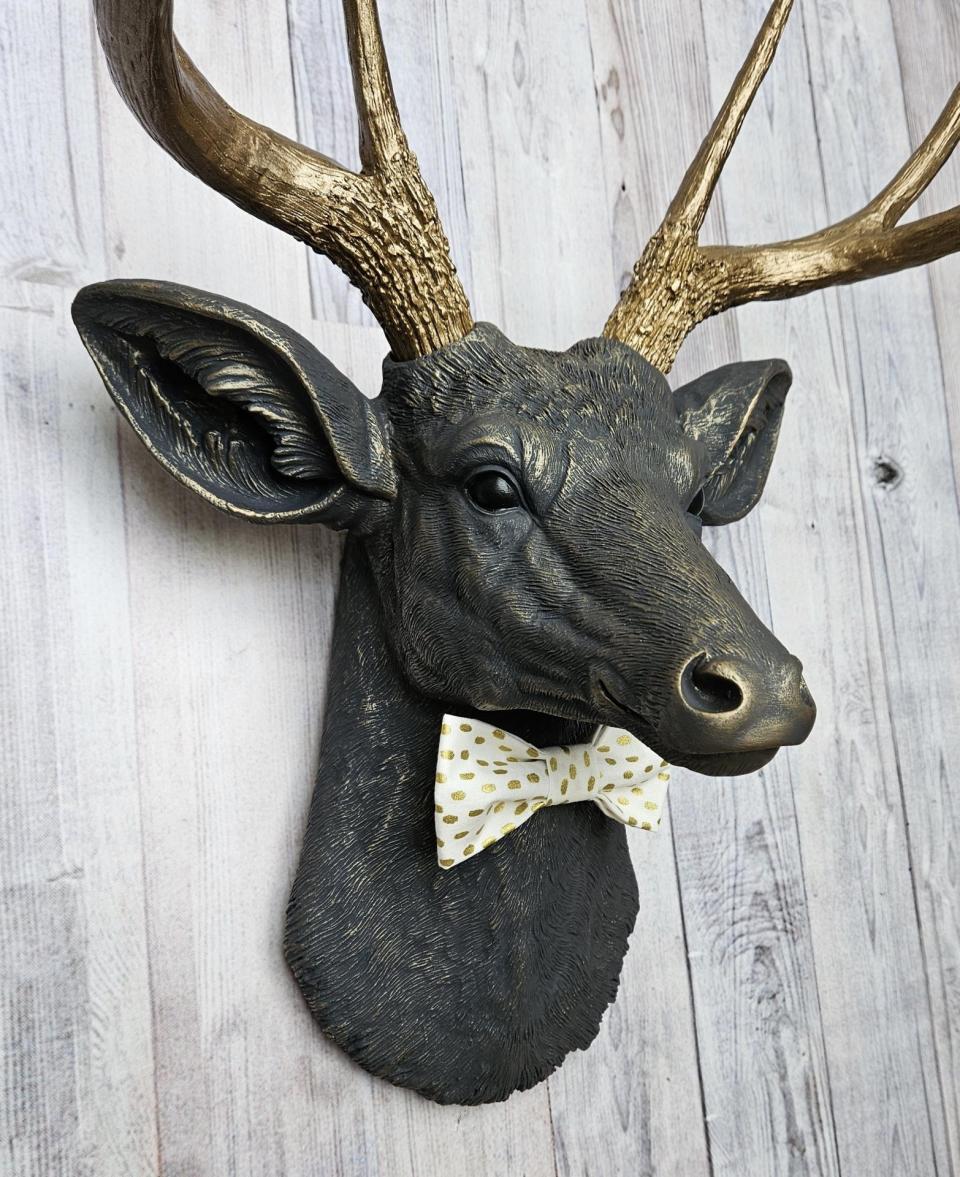 Faux taxidermy deer head, painted slate grey with antique gold accents. 