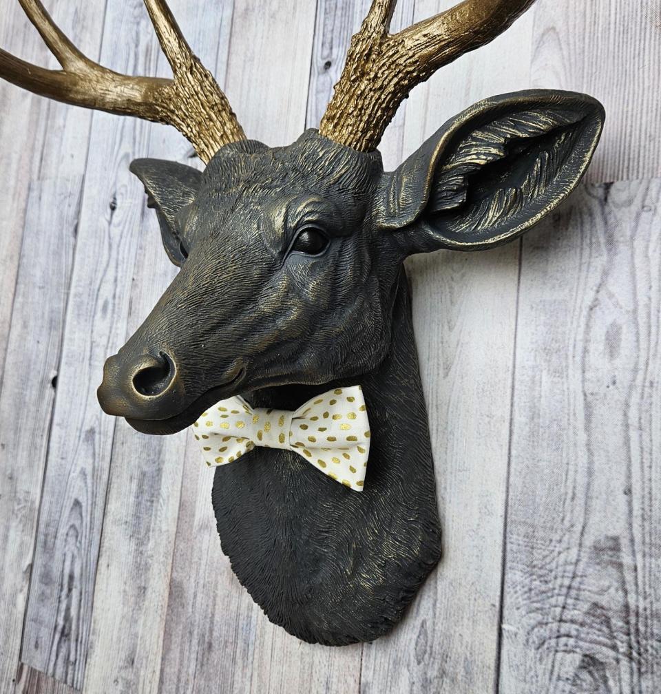 Faux taxidermy deer head, painted slate grey with antique gold accents. 