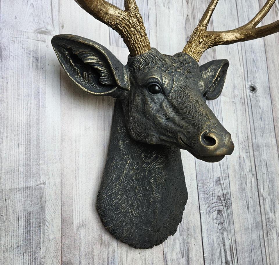 Faux taxidermy deer head, painted slate grey with antique gold accents. 
