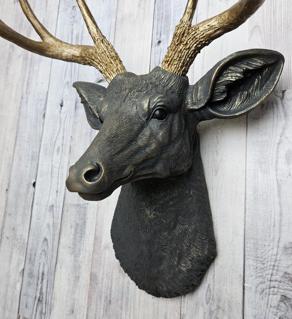 Faux taxidermy deer head, painted slate grey with antique gold accents. 