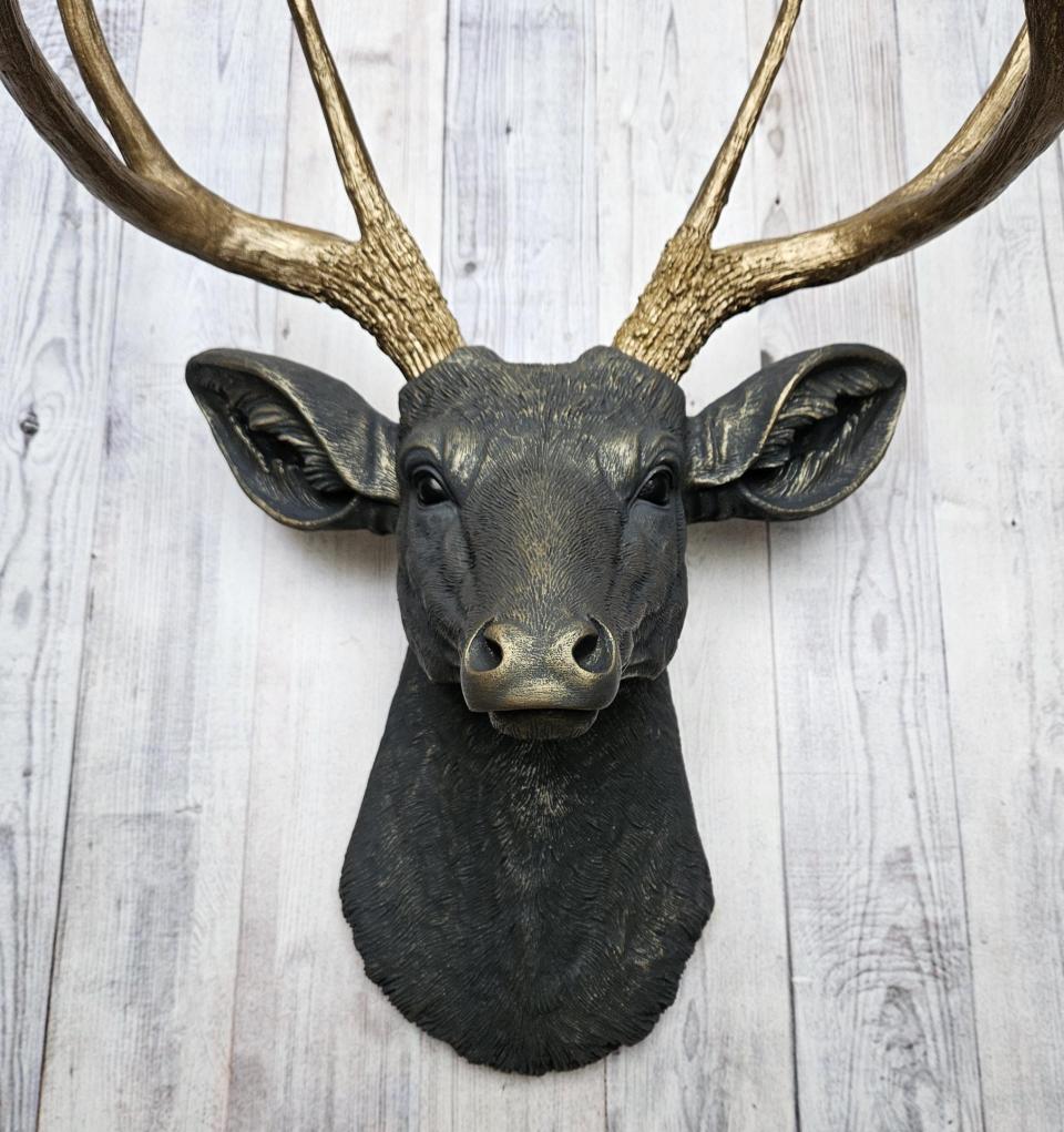 Faux taxidermy deer head, painted slate grey with antique gold accents. 