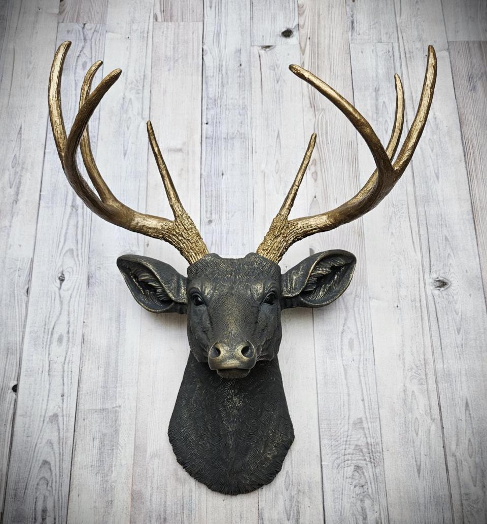 Faux taxidermy deer head, painted slate grey with antique gold accents. 