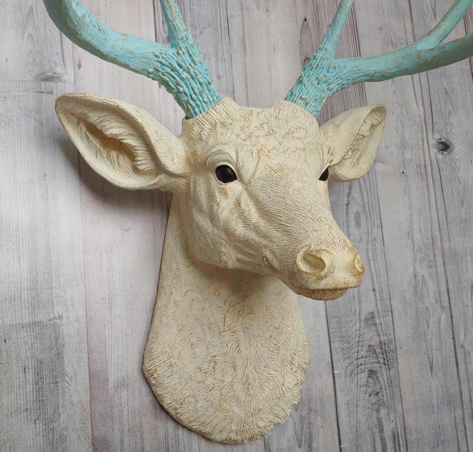 Faux taxidermy deer head, painted antique white with spa blue and gold accents. The antlers are spa blue with gold accents.