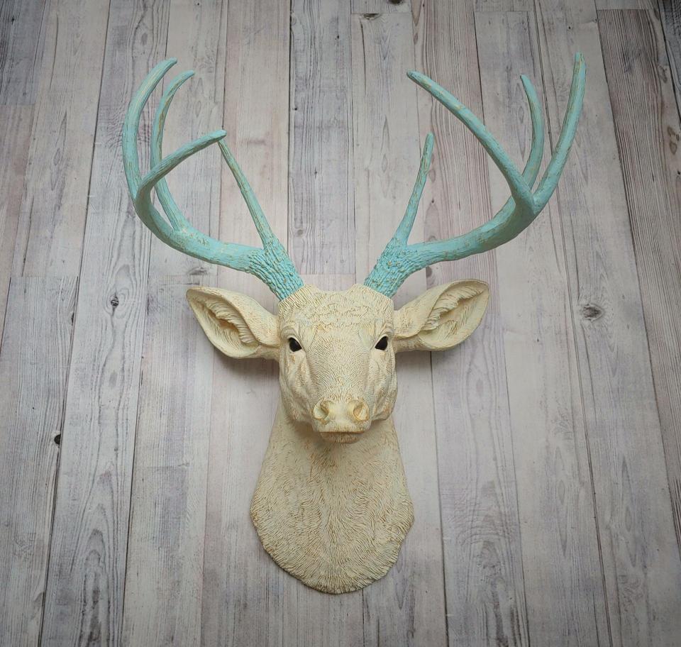 Faux taxidermy deer head, painted antique white with spa blue and gold accents. The antlers are spa blue with gold accents.