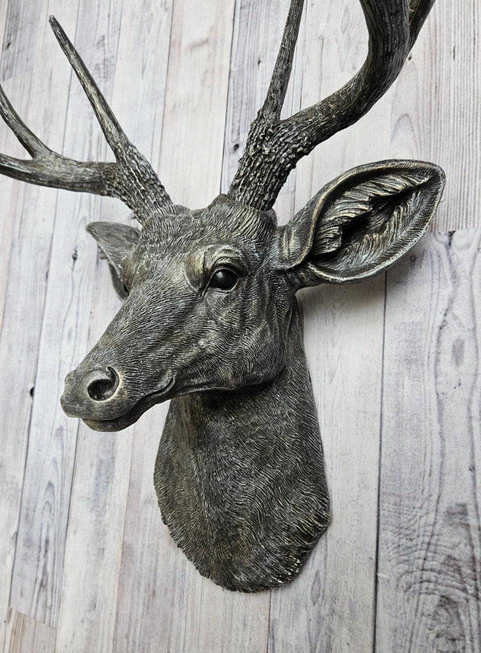 Faux taxidermy deer head, painted chestnut brown with antique white and gold accents. The antlers have been painted the same way.